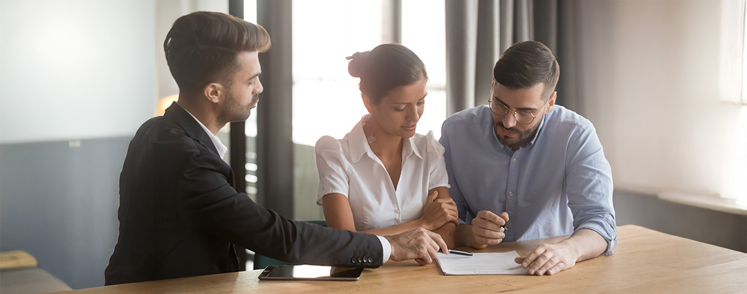 Divorced couple meeting with an attorney to discuss Innocent Spouse tax relief.